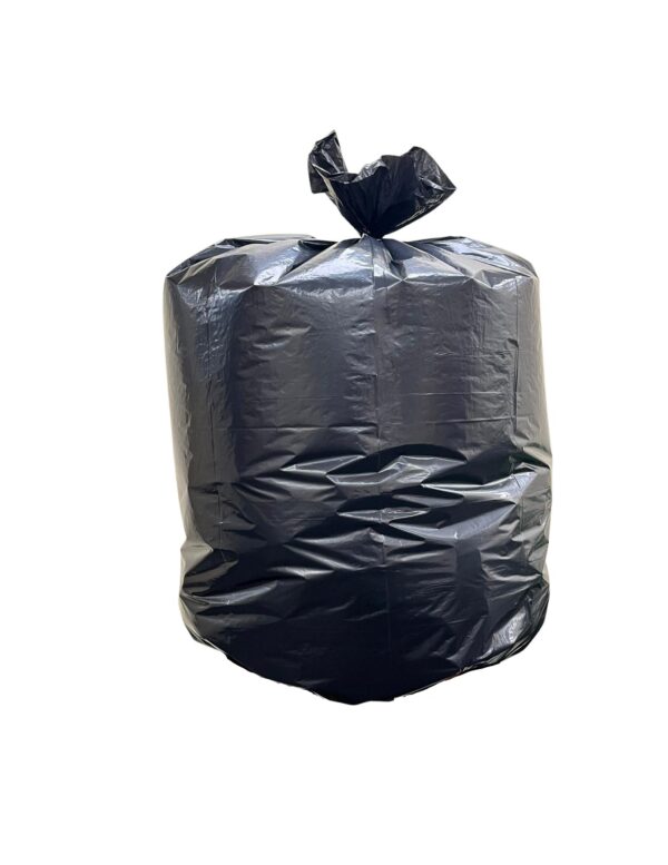 Black trash bag with closed knot on the display